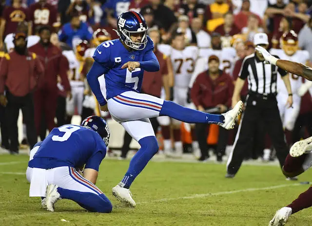 New York Giants outside linebacker Azeez Ojulari (51) and New York Giants  defensive end Leonard Williams (99) react against the Carolina Panthers  during an NFL football game, Sunday, Oct. 24, 2021, in