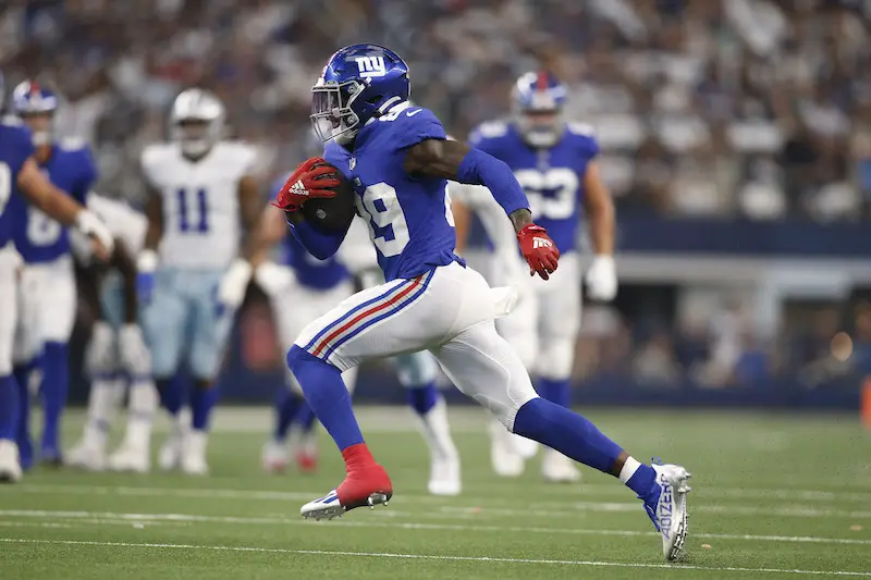 New York Giants outside linebacker Azeez Ojulari (51) and New York Giants  defensive end Leonard Williams (99) react against the Carolina Panthers  during an NFL football game, Sunday, Oct. 24, 2021, in