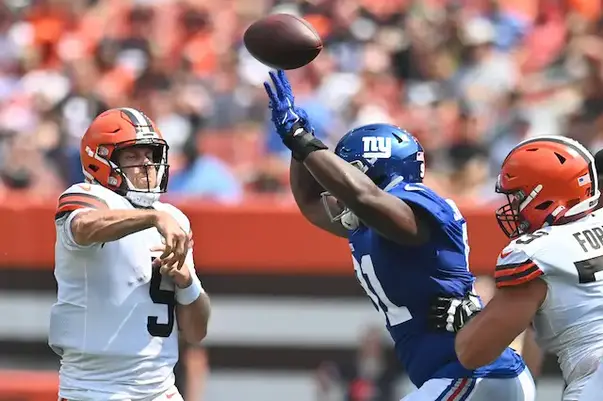 Cleveland Browns quarterback Kyle Lauletta (17) rushes against New York  Giants defensive tackle David Moa (96)